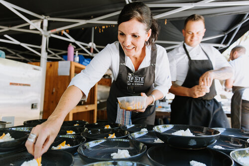 Dominique Rizzo cooking at the 2021 Taste Port Douglas Long Lunch presented by Jansz Australia